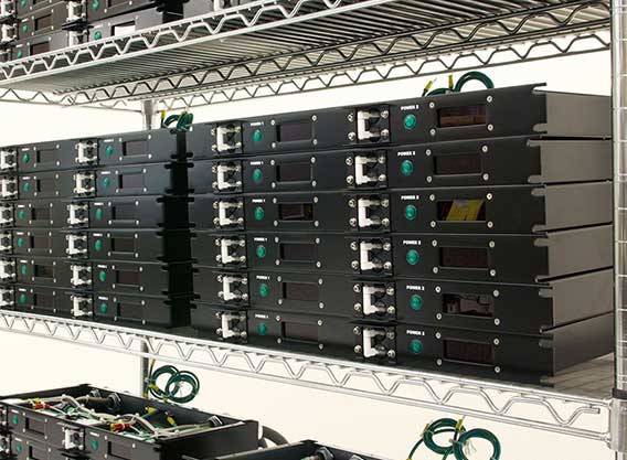 A photo of multiple PDUs stacked in manufacturing.
